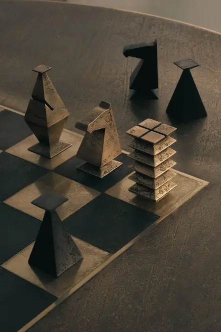 Moody still life of angular chess pieces on a dark board.
