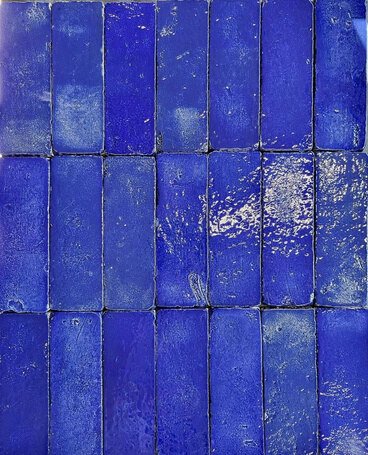 Close view of glossy cobalt blue handmade tile.