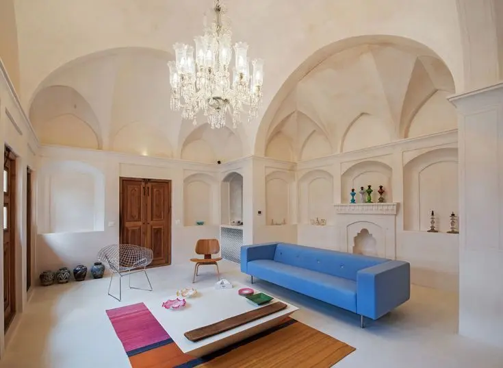 Reference photograph of a pale vaulted Iranian interior with repeated arched niches.