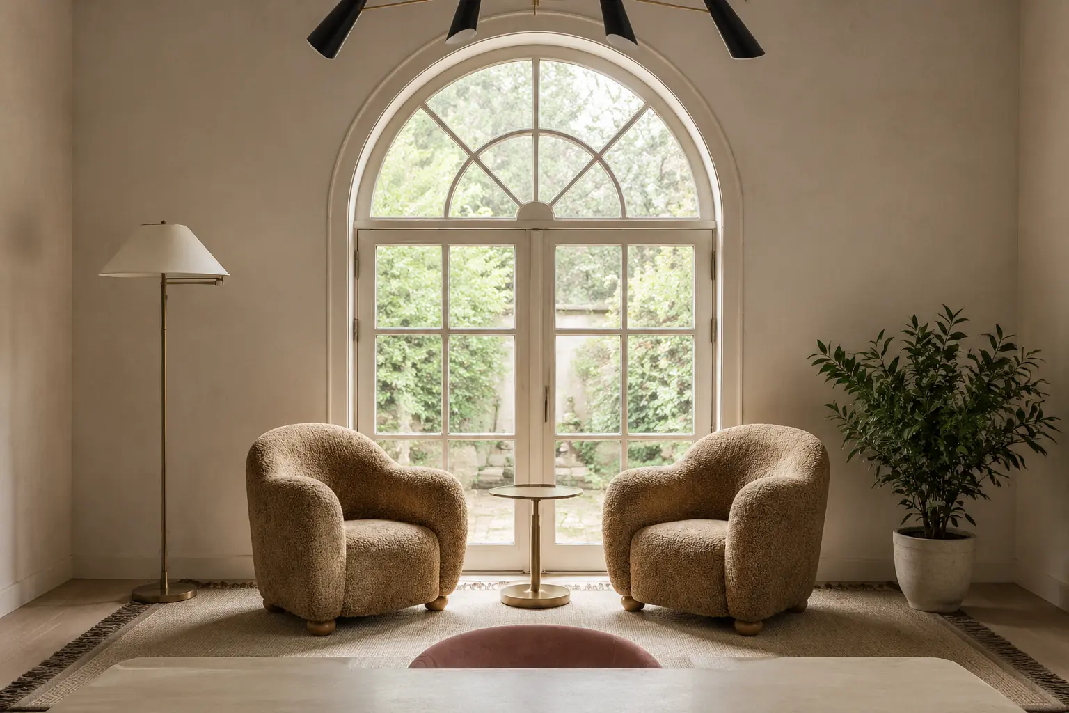 Concept visualization of a warm home-office lounge with two rounded chairs, brass table, floor lamp and plant in front of arched garden doors.
